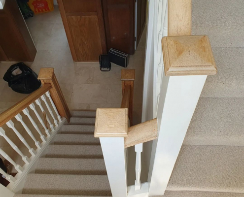 Surrey home with beige wool loop carpet on double staircase