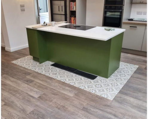 Surrey kitchen-diner with oak LVT wide plank flooring installed, showing warm tones and textured surface