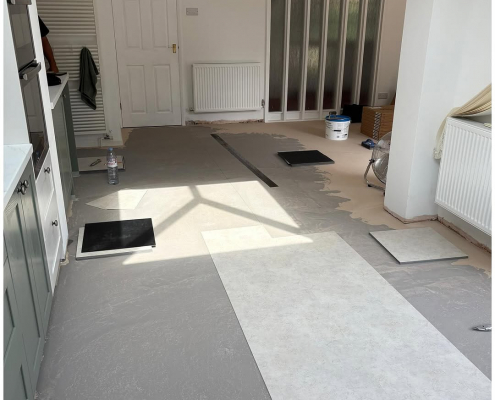 Surrey kitchen-diner dining area with light stone-effect LVT mid-installation