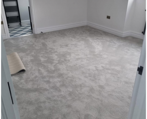 Surrey bedroom with soft, light grey installed