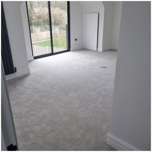 Bright Reigate bedroom with soft, light grey carpet installed