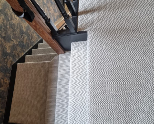 Surrey staircase and landing with flatweave herringbone carpet installed