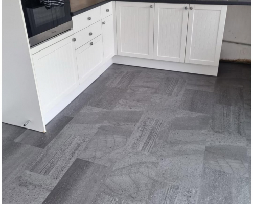 Redhill kitchen-diner with mid-grey stone-effect LVT flooring installed, kitchen view