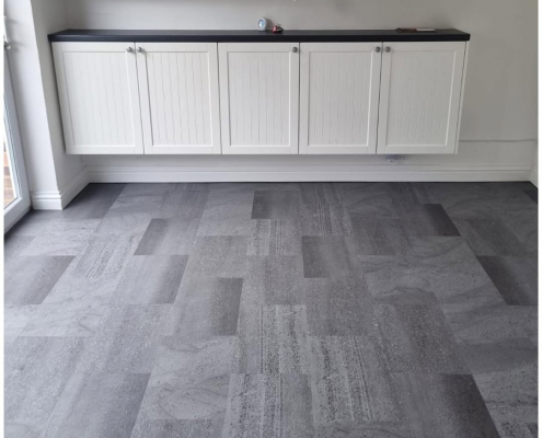 Redhill kitchen-diner with mid-grey stone-effect LVT flooring installed, dining area