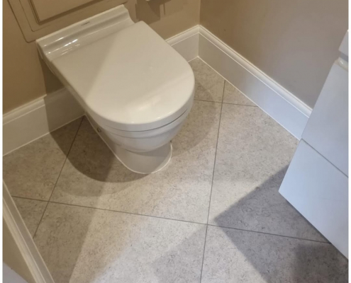 Kent bathroom with light stone-effect luxury vinyl tiles installed