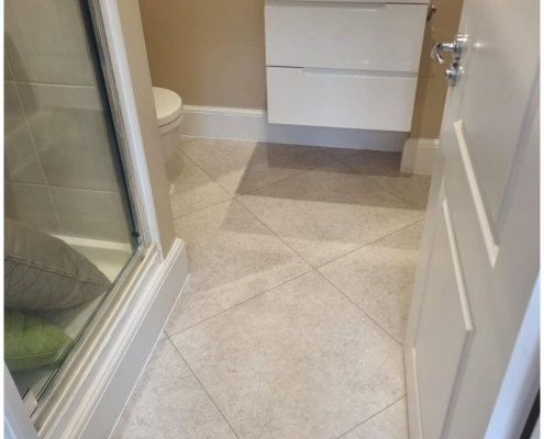 Kent bathroom with light stone-effect LVT installed