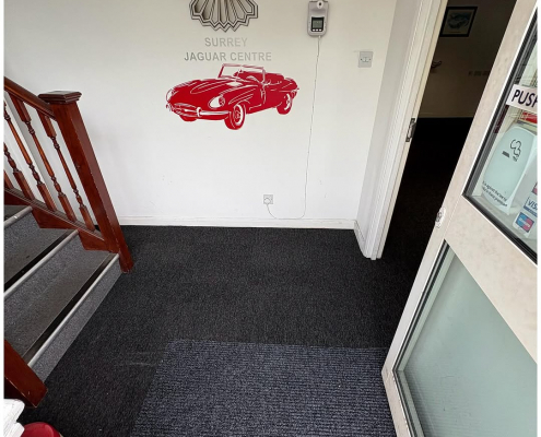 Surrey office entrance with new dark grey carpet tiles installed