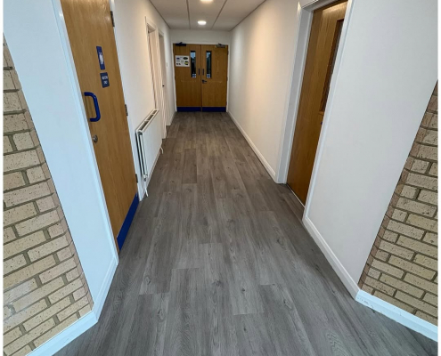 Grey oak commercial LVT installed in a corridor as part of a flooring update for a business in Kent.
