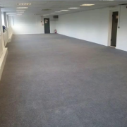 Grey carpet tiles in office flooring installation in Redhill