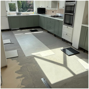 Surrey kitchen-diner kitchen area with light stone-effect LVT mid-installation