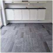 Redhill kitchen-diner with mid-grey stone-effect LVT flooring installed, dining area