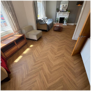 Bright Surrey living room with warm oak herringbone LVT flooring installed