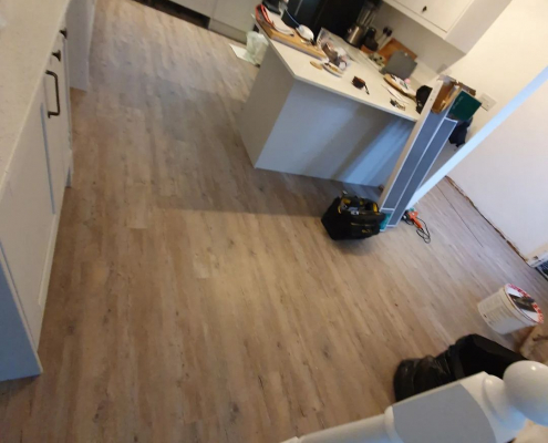 Kitchen with oak effect LVT Reigate kitchen with oak luxury vinyl flooring installed