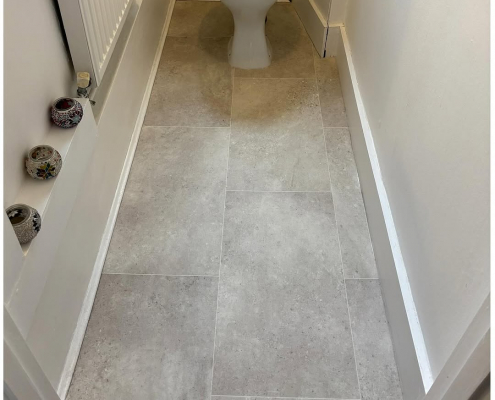 Cloakroom with grey stone effect cushion vinyl Cloakroom with soft grey stone-effect cushion vinyl flooring installed