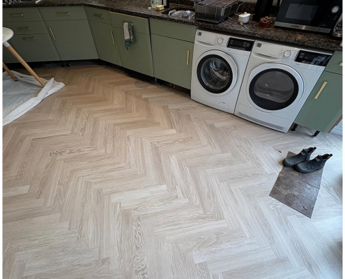 Herringbone LVT kitchen flooring Kitchen in Redhill with oak herringbone LVT flooring installed