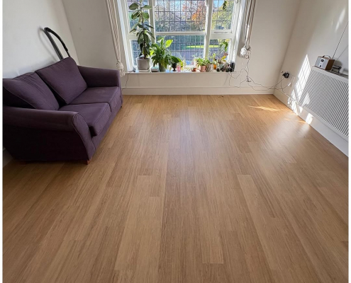 Living room warm oak plank LVT installation Living room in Surrey with completed oak LVT flooring installed