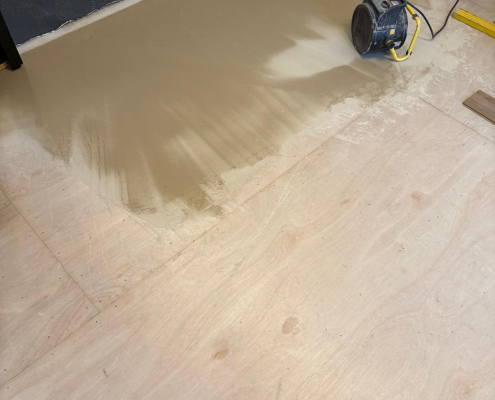 Living Room Floor Preparation Before Laminate Installation Living room plywood subfloor and feather finish preparation prior to warm oak effect herringbone laminate fitting