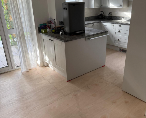 Open Plan Kitchen Diner Subfloor Installation Plywood subfloor installed throughout kitchen diner before fitting Furlong Manor herringbone laminate flooring in Surrey property.