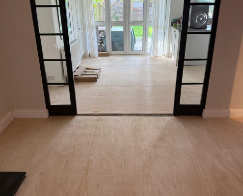 Plywood Subfloor Preparation for Herringbone Flooring Plywood subfloor preparation installed over original floorboards before fitting herringbone laminate flooring in open plan living and dining area.